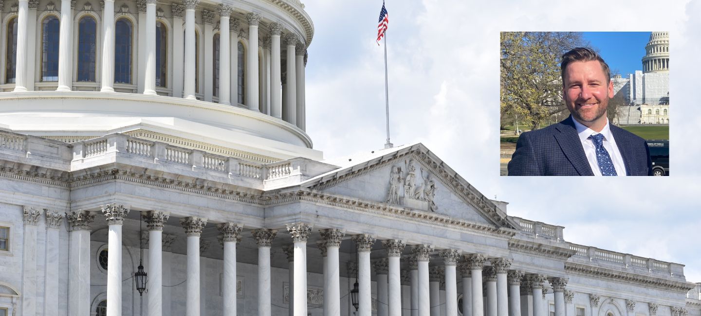 Picture of US Congress with picture of Bentley Johnson in the corner.